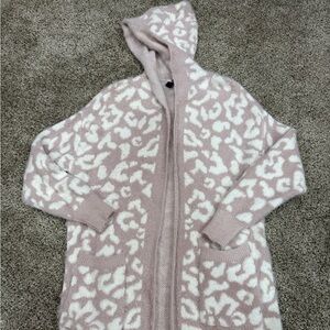 Sweater cardigan lavender/white has side slits. Women’s size medium/large.